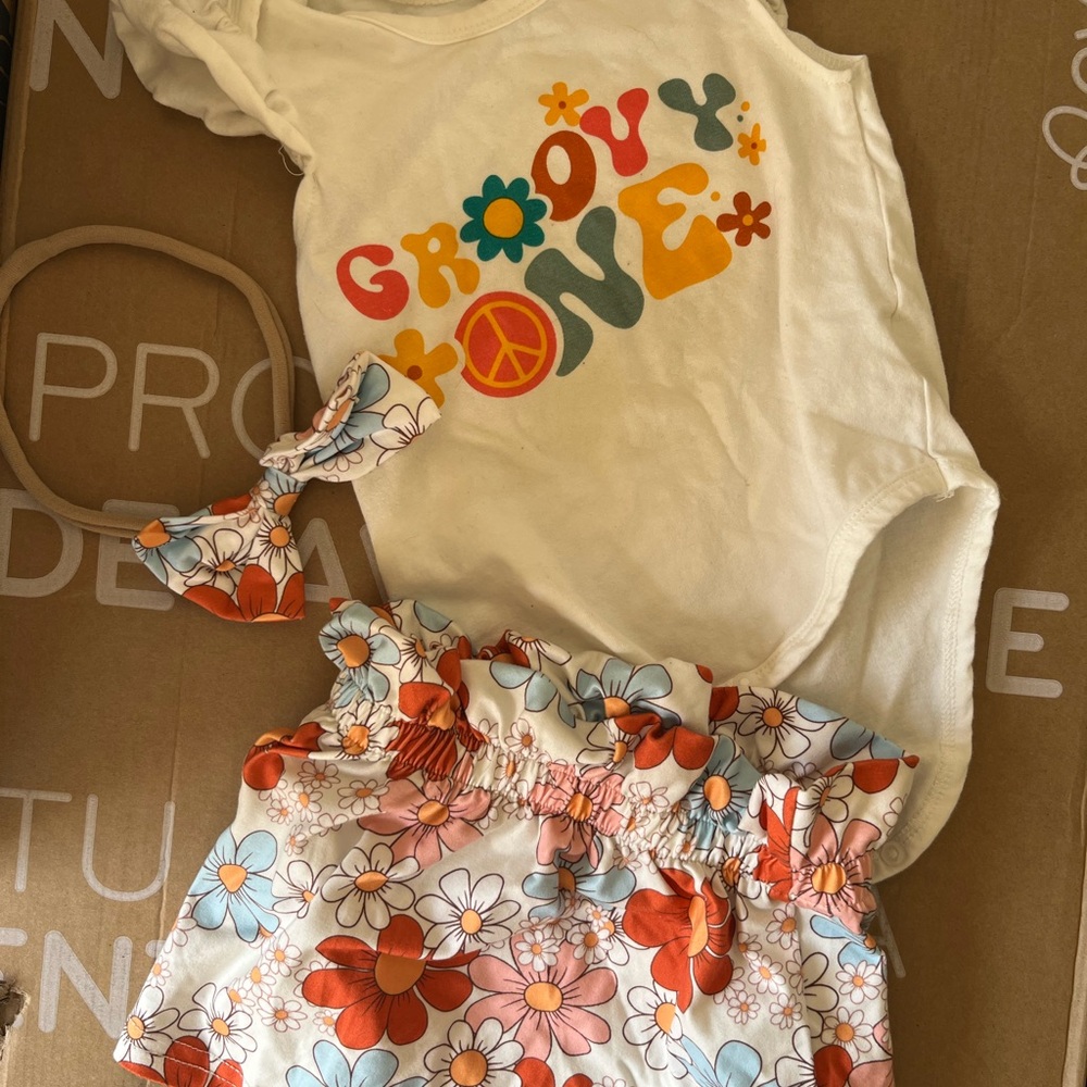 "Groovy Babe" birthday decor plus outfits for dad mom and 1 year old girl